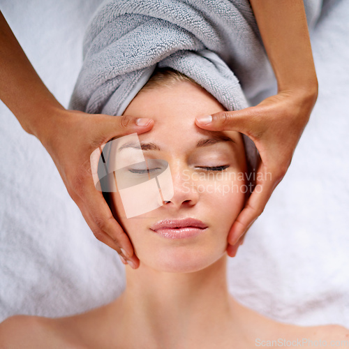 Image of Letting all her cares melt away. Cropped shot of a young woman enjyoing a massage at the day spa.