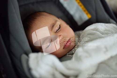 Image of This car trip is going to be a dream. Shot of an adorable baby boy sleeping in a car seat.