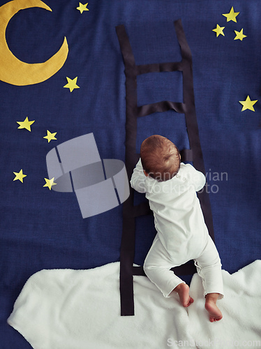 Image of Dream chaser. Concept shot of an adorable baby boy climbing a ladder against an imaginary night time background.