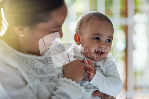 Image of Mommys lil love bug. Shot of an adorable baby boy bonding with his mother at home.