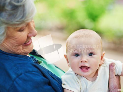 Image of Little boys are just superheroes in disguise. Cropped shot of a baby boy spending time outdoors with his grandmother.