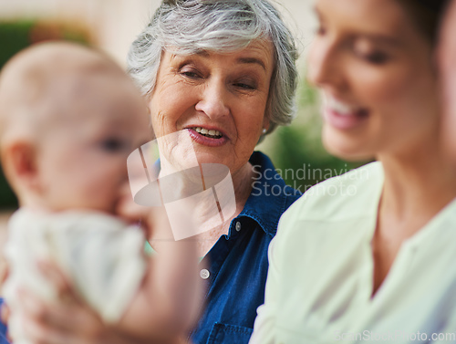 Image of Hes just so adorable. Cropped shot of a three generational family spending time outdoors.