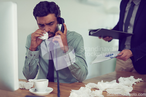 Image of He could do with a time-out from work. Cropped shot of a businessman suffering with allergies in an office.