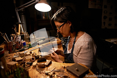 Image of My creation station. An artist creating something out of wood.