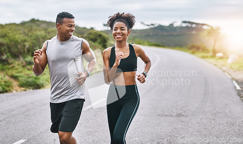 Image of The healthier you are, the happier you feel. Shot of a sporty young couple exercising together outdoors.