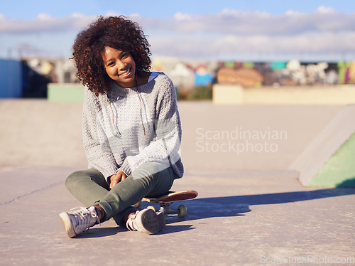 Image of Its a great day to skate. Shot of a young woman in a skate park.