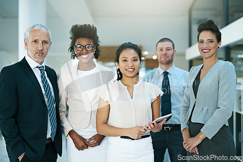 Image of Theyre led by a confident, charismatic leader. Portrait of a group of businesspeople standing together.