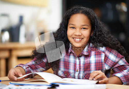 Image of My favorite subject is everything. Portrait of a young firl studying at a desk in a classroom.