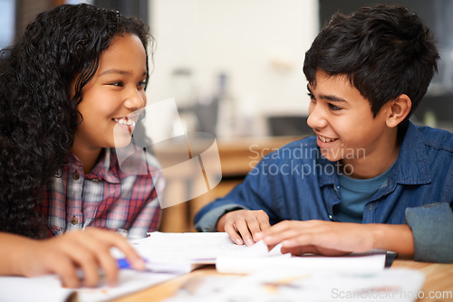 Image of Getting a bit of after class help. Shot of two young students studying together in a classroom.