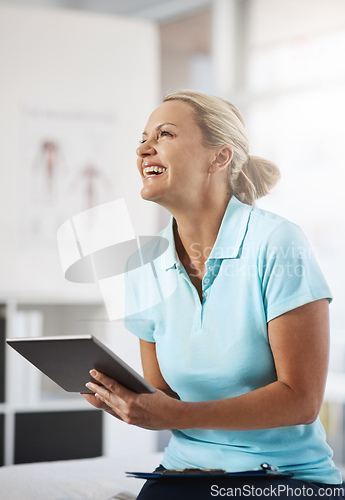 Image of This way is so much easier. Cropped shot of a mature female physiotherapist working in her office.