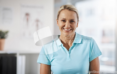 Image of Im here to help you heal. Cropped portrait of a mature female physiotherapist working in her office.