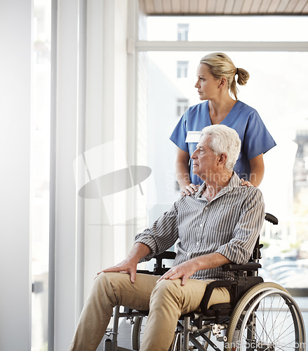 Image of Making sure hes not cooped up in his recovery room. Cropped shot of a mature female nurse and her senior male wheelchair-bound patient in the hospital.