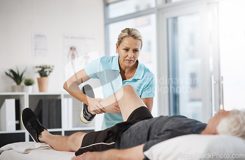 Image of Lets test out your mobility. Cropped shot of a mature female physiotherapist working with a senior male patient in her office.