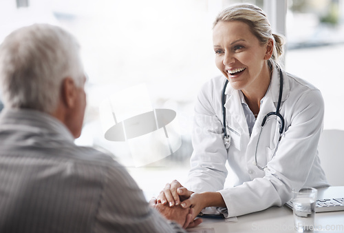 Image of Im glad to see youre in such great health. Cropped shot of a mature female doctor working with a senior male patient in her office in the hospital.