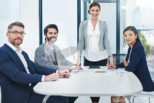 Image of Well have it sorted in no time. Portrait of a group of corporate businesspeople meeting in the boardroom.