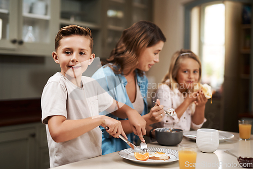 Image of Its breakfast time. Cropped shot of a young family having breakfast at home.