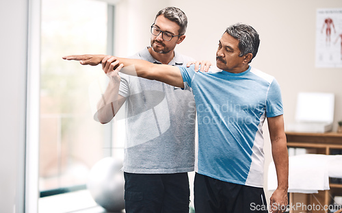 Image of It all starts with a stretch. Shot of a senior man going through rehabilitation with his physiotherapist.