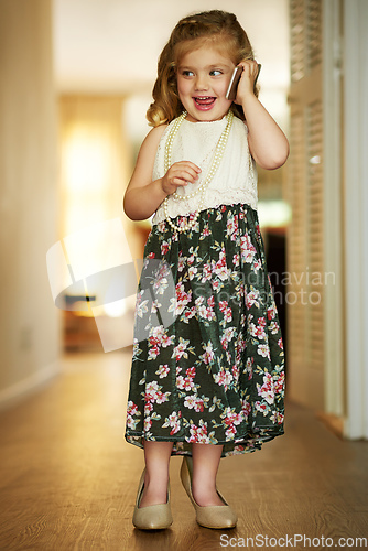 Image of Shes an adorable little busy bee. Shot of an adorable little girl playing dress-up at home.