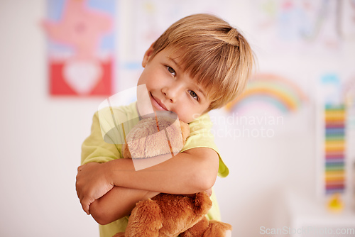 Image of Childhood moments. Portrait of a cute little boy hugging his stuffed animal.