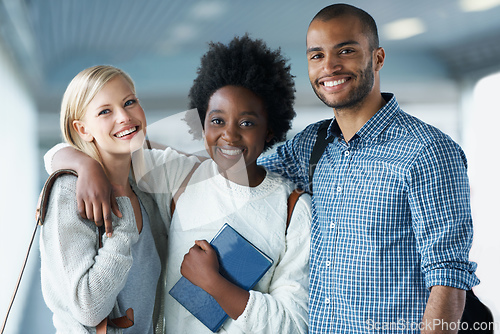 Image of Making connections while they are still in College. Portrait of smiling University students arm in arm.