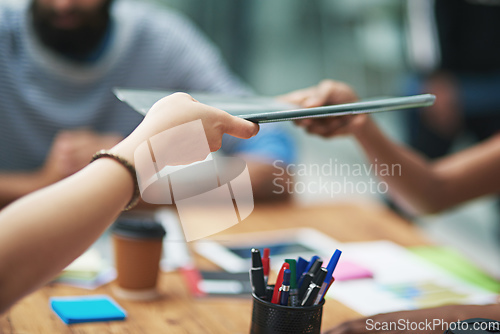 Image of Here, have a look at the latest report. Cropped shot of an unidentifiable businessperson passing a file to a colleague.