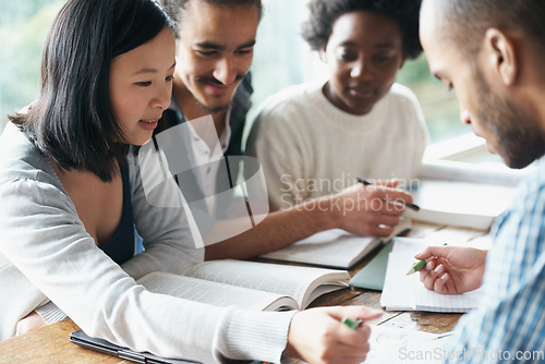 Image of This problem is relatively simple.... A group of college students sitting together and studying.