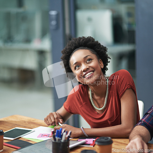 Image of Nothing compares to seeing her ideas realized. Cropped shot of a creative businesswoman looking happy at a meeting.