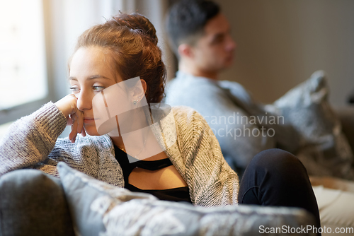 Image of Going through a rough patch. Shot of a young woman looking despondent after a fight with her boyfriend.