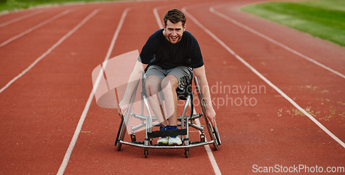 Image of A person with disability in a wheelchair training tirelessly on the track in preparation for the Paralympic Games