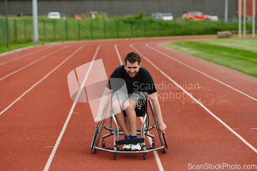Image of A person with disability in a wheelchair training tirelessly on the track in preparation for the Paralympic Games