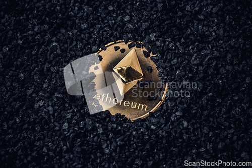 Image of Gold coin with cryptocurrency logo