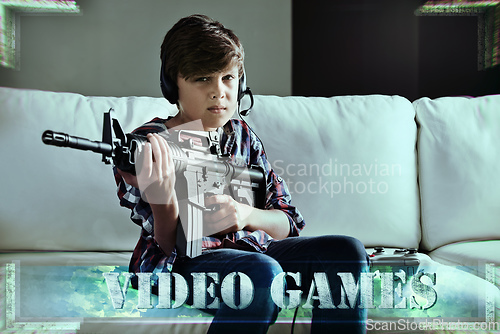 Image of Lock and load time. Shot of a young boy playing violent video games.