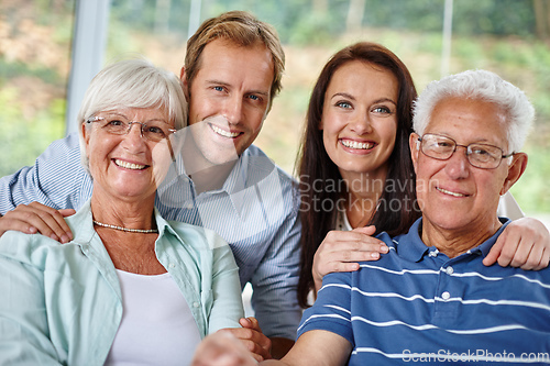 Image of Family is like a small piece of Heaven. Portrait of a happy family of four smiling at the camera.