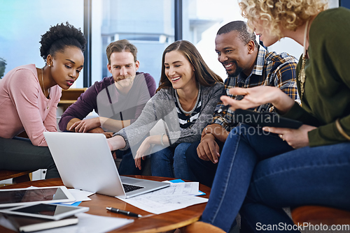 Image of Working through ways to bring their best concepts to life. Cropped shot of a team of designers working together in the office.