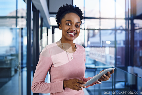 Image of Success has no limit so keep pushing yourself further. Portrait of a young businesswoman working on a digital tablet in the office.