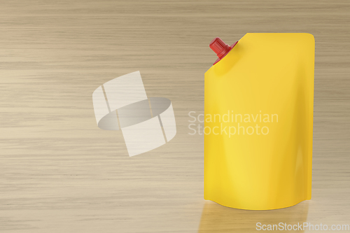 Image of Yellow stand-up pouch with spout