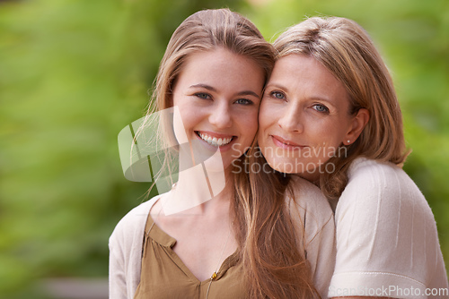 Image of Theyve always been very close. Portrait of a mother embracing her daughter.