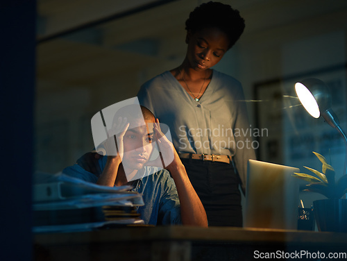 Image of I never seem to see the end of my deadlines. Cropped shot of a young businessman looking stressed out while a colleague tries to console him.