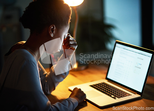 Image of Every job comes with its own pressure. Cropped shot of a young businesswoman looking stressed out while working late in an office.