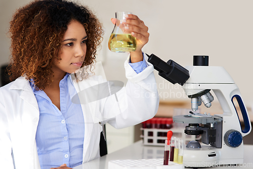 Image of Waiting for the solution to reveal itself. Cropped shot of a young female scientist conducting an experiment in the lab.