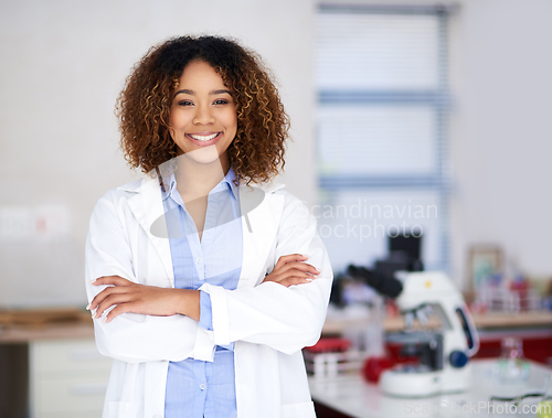 Image of Ill find the cure. Portrait of an attractive young scientist standing with her arms folded in the lab.