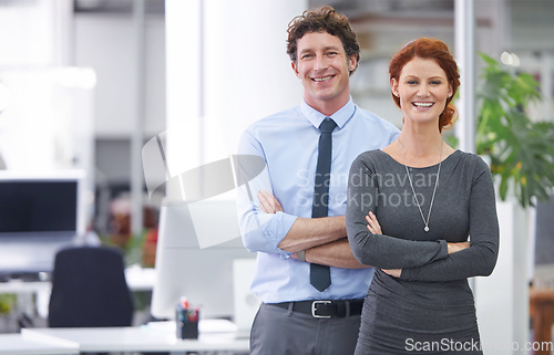 Image of They make a great business team. Cropped shot of two colleagues standing in an office.