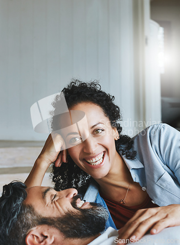 Image of Love is about laughing together. Shot of a relaxed couple enjoying the day at home together.