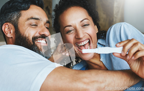 Image of Were going to be parents. Shot of a happy couple celebrating their new pregnancy at home together.