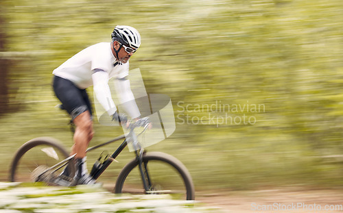 Image of Nature mockup, bicycle or sports man travel, ride and journey on freedom adventure, extreme triathlon race or cycling. Mountain bike, forest speed blur and athlete training for competition in woods