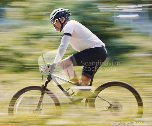 Image of Fitness, freedom and man cycling in forest for speed, training or nature, workout and off road race. Energy, workout and cyclist on mountain bike for extreme sports, adrenaline or power performance