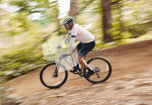 Image of Blur fast, cycling and man in nature training for a race, marathon or competition in forest. Adventure, fitness and cyclist athlete riding bicycle at speed on mountain for cardio exercise or workout.