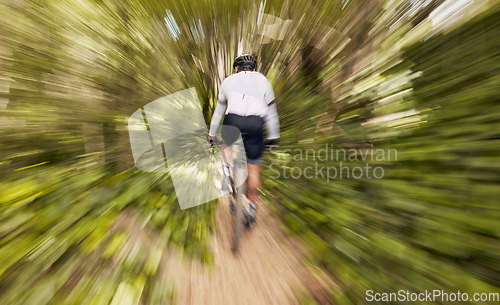 Image of Blur motion, cycling and man in nature training for a race, marathon or competition in a forest. Fast, fitness and back of male cyclist athlete riding bicycle at speed for cardio exercise or workout.