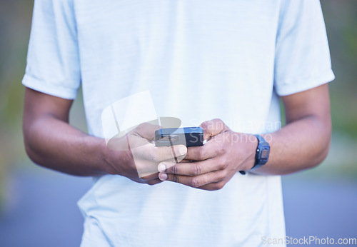 Image of Hands, typing and man with phone for communication, contact or social media post on internet, website or network connection. Cellphone, mobile app or person with research online for fitness or health