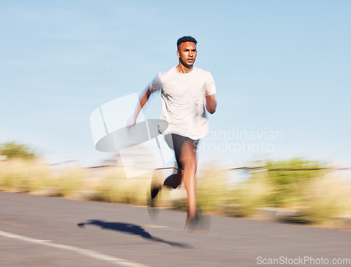 Image of Man, training and running on road in mountain, nature or outdoor exercise and athlete moving with speed, motion or workout. Male, fitness and runner in morning cardio, sports or goals for wellness